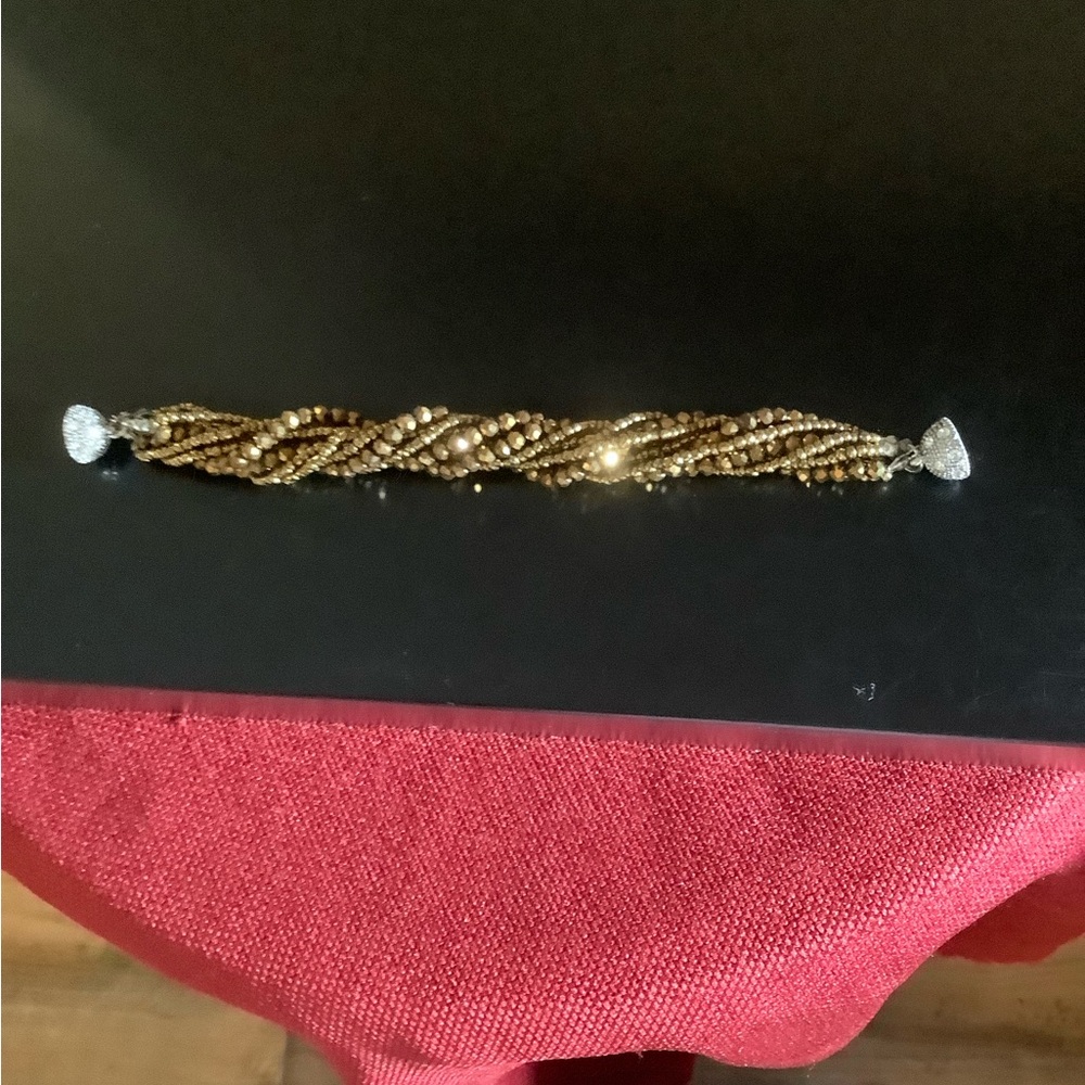 Gold-Tone Twisted Beaded Bracelet with magnetic clasp.